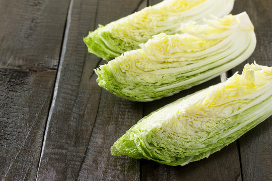 Fresh Chinese cabbage on vintage wooden background. Space for yo