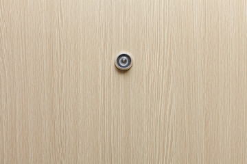 Lens peephole on new wooden door