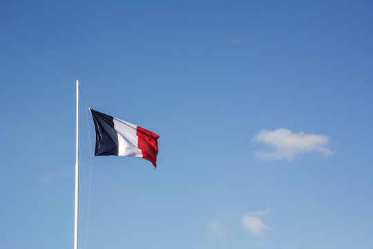 French flag with blue sky as background