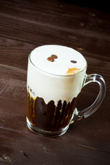 Irish coffee on the dark wooden background