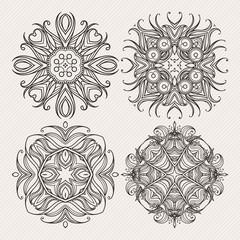 Set of ornate vector mandala symbols. Mehndi lace tattoo. Art Nouveau weave.