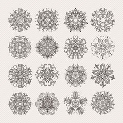 Set of ornate vector mandala symbols. Mehndi lace tattoo. Art Nouveau weave.