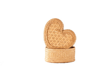 A handmade product, heart-shaped wicker box isolated on white ba