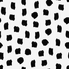 Abstract seamless pattern with brush strokes in black on cream background.
