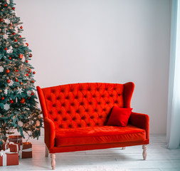 Beautiful background Christmas Living Room with decorated Christmas tree, couch and gifts.  The idea for postcards. Soft focus. Shallow DOF