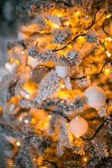 Beautiful background decorated Christmas tree with toy balls and garlands.The idea for postcards. Soft focus. Shallow DOF