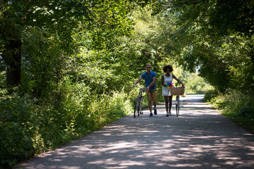 Young  couple having joyful bike ride in nature