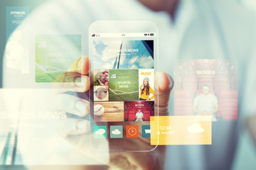 close up of male hand with news on smartphone