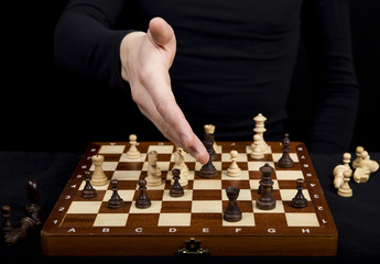 girl in a black dress stretched out her hand to the opponent on
