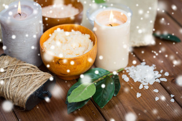 natural body scrub and candles on wood