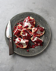 Juicy pomegranates on wood