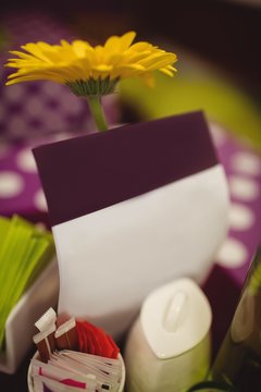 Flower and greeting cards on table setting