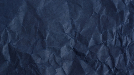 black creased paper for a background texture.