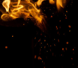 fire flames with sparks on a black background