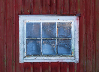 Old worn window in a barn.
