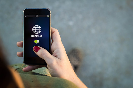Woman walking smartphone interface roaming