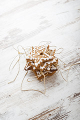 Fototapeta premium Gingerbread icing cookies with gold cord. Christmas decoration.
