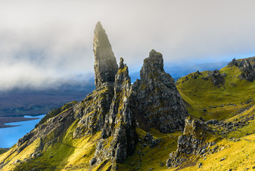 Sunrise at The Old Man of Storr - beautiful panorama of an amazing scenery with vivid colors - symbolic tourist attraction - mystery around the landmark