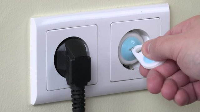 Hand remove safety plug from electricity outlet and insert plug wire