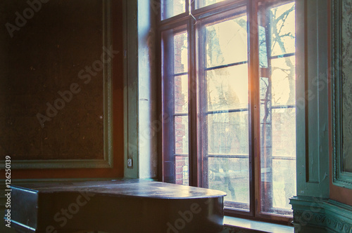 Old Piano In Old Room With A Window Stock Photo And Royalty