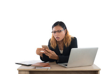  Business woman serious with smartphone while working with her l