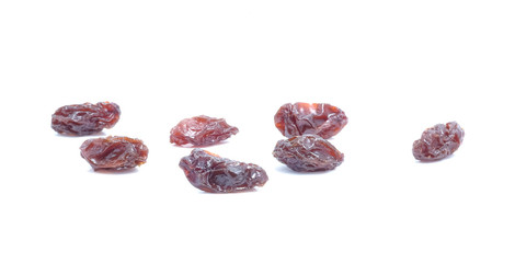 Dried grapes on white background.