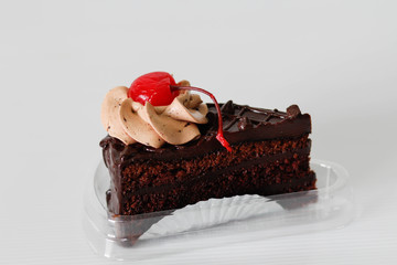 piece of chocolate cake and cherry