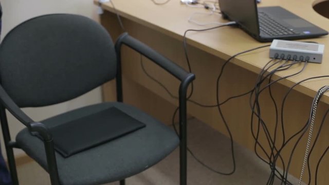 Man connects the lie detector, polygraph. Hi-tech