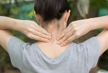 Fototapeta premium Woman's hand on her neck,Medical concept,