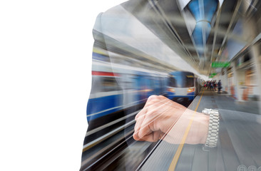 Obraz premium Business looking his watch in train station in rush hour
