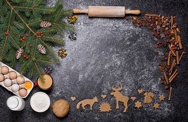 Baking ingredients for Christmas cookies gingerbread. Molds for baking, spices and  decorations for Christmas.