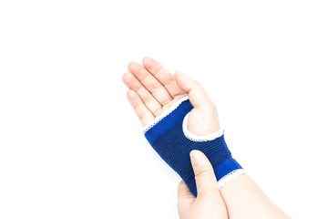 Woman with blue bandage having pain in her wrist isolated on whi