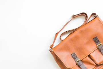 Men's accessories with brown leather bags, flat lay, top view.