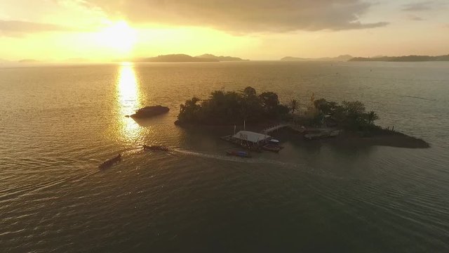 Aerial Flight Over Sea to Island at Sunset Ranong Thailand