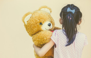 Little girl and teddy bear
