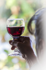 Woman holding a glass of red wine