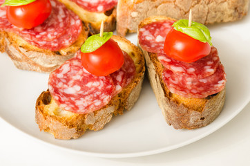 Crostini with salami, tomato and basil, Italian Appetizers