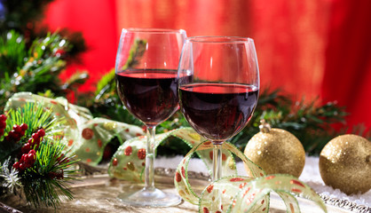 Red wine glasses on snow