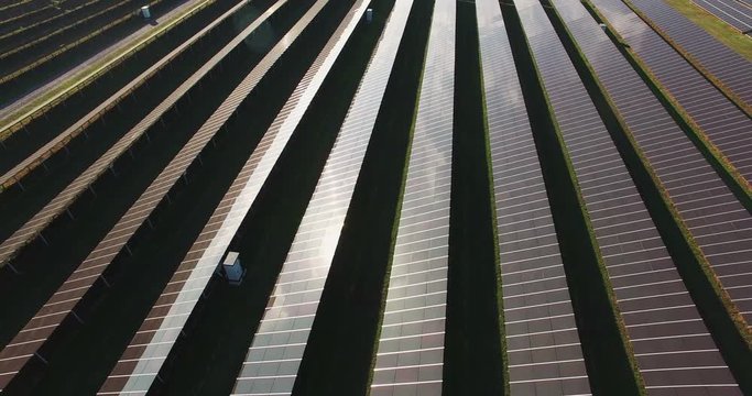 Drone shot of solar batteries in the field of electric production factory