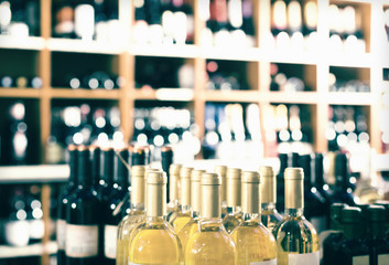 View on supermarket shelves with wine bottles