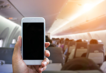 Man use your phone in airplane blurred background