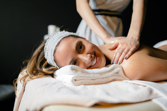 Beautiful woman enjoying massage treatment