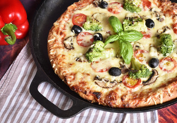 delicious vegetarian pizza, handmade pizza in a pizza pan. High angle view.