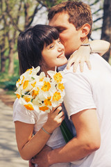 Loving young beautiful couple on a date in park. summer warm weather