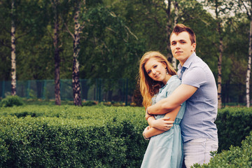 Fototapeta premium Loving young beautiful couple on a date in park. summer warm weather