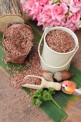 flax seeds for health on wood background.