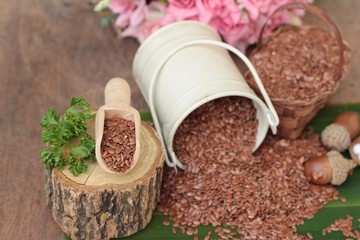 flax seeds for health on wood background.