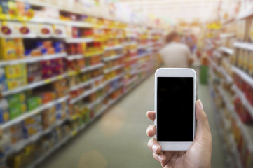 Holding smart phone isolated over white background - mockup