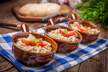 Fried cabbage greens and onion in wooden table.