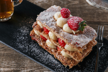 Millefeuille dessert with strawberries dessert sweet on black background cake